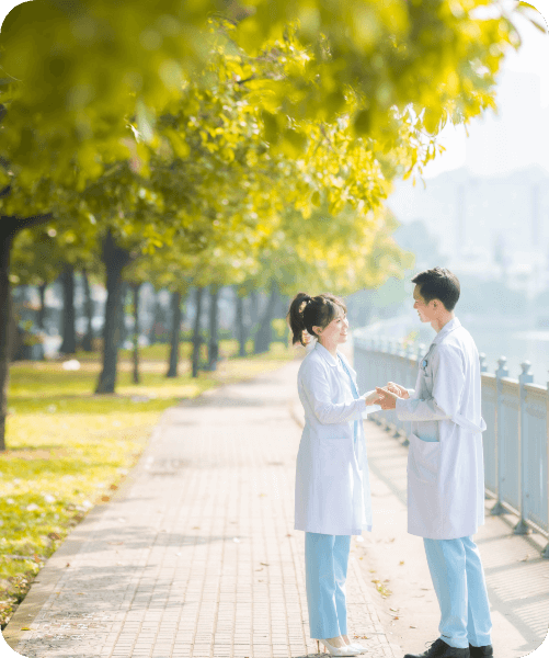 two clinicians talking outdoors